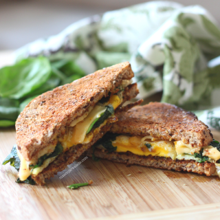 Egg and Cheese with Crispy Spinach on Ezikiel
